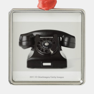 Close-up of a rotary phone metal ornament