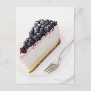 Close-up of a slice of blueberry cheese cake postcard