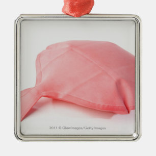 Close-up of a whoopee cushion metal ornament