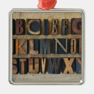 Close up of alphabet on letterpress metal ornament