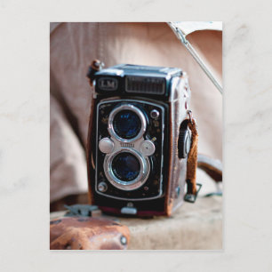 Close-up of an antique camera postcard