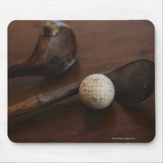 Close up of antique golf clubs and golf ball mouse pad