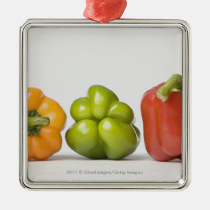 Close-up of bell peppers in a row metal ornament
