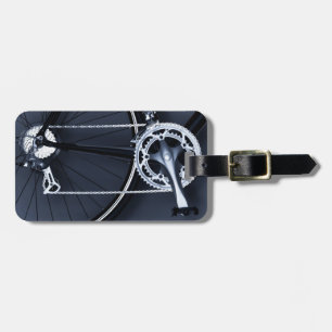 Close up of bicycle chain, pedal and gears luggage tag
