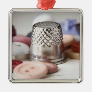 Close-up of buttons with a metal cap ornament