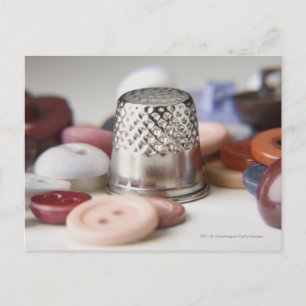 Close-up of buttons with a metal cap postcard