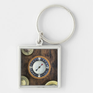 Close Up Of Chinese Compass And Gold Weights Keychain