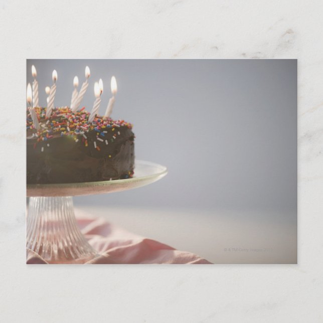 Close up of chocolate birthday cake with candles postcard (Front)