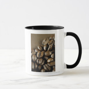 Close-up of coffee beans mug
