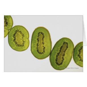 Close-up of five slices of kiwi fruit
