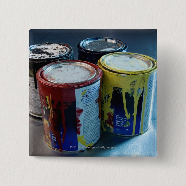 Close-up of four paint cans 2 inch square button (Front)