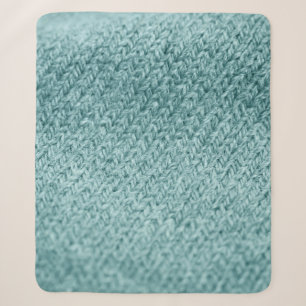 Close up of green knitted textured background.  sherpa blanket