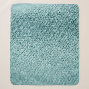 Close up of green knitted textured background.  sherpa blanket