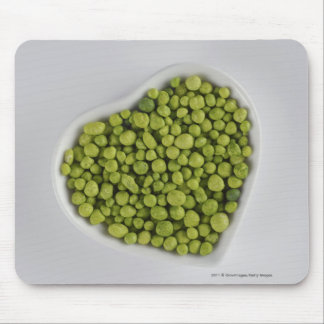 Close-up of green pebbles in a heart shape bowl mouse pad