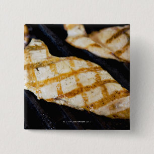 Close-up of grilled chicken breasts 2 inch square button
