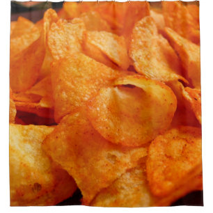 Close up of juicy, crispy, chips on black plate.