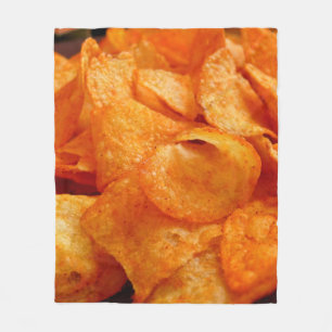 Close up of juicy, crispy, chips on black plate. fleece blanket