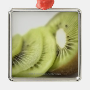 Close-up of kiwi slices metal ornament