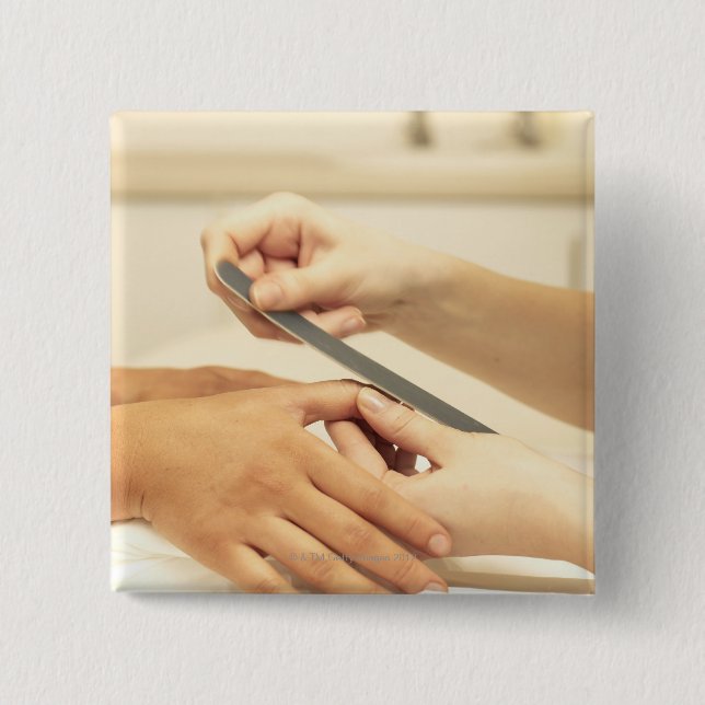 Close up of manicure 2 inch square button (Front)