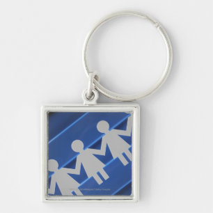 Close-up of paper chain dolls keychain