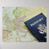Close-up of passport lying on European map