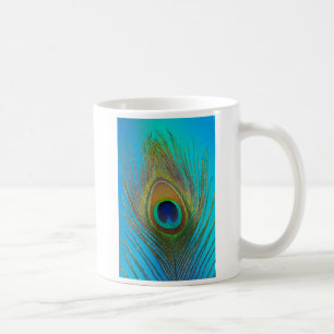 Close up of peacock feather coffee mug