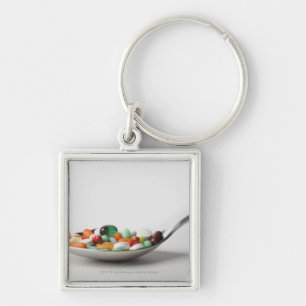 Close-up of pills in a spoon keychain