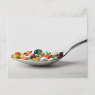 Close-up of pills in a spoon postcard