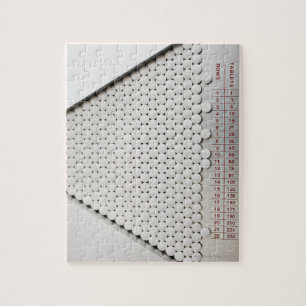 Close up of pills in sorting tray jigsaw puzzle