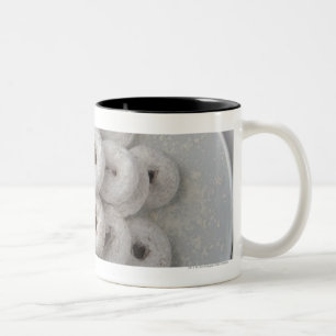 Close-up of powdered doughnuts in a plate Two-Tone coffee mug