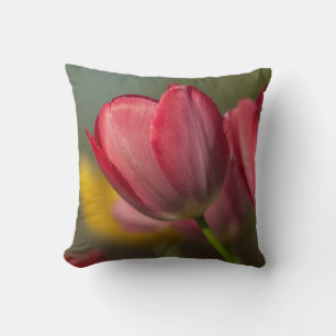 Close-up of red and yellow tulips in garden throw pillow