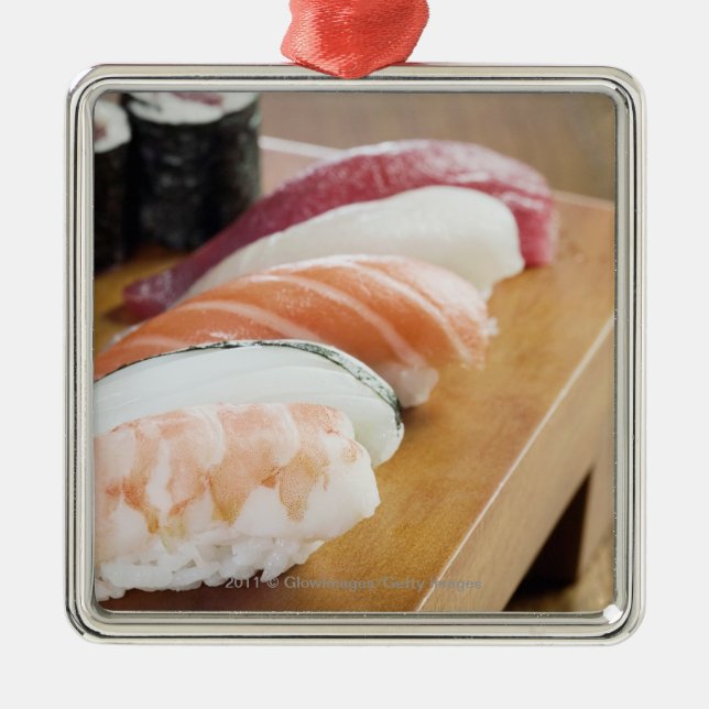 Close-up of sushi on a table metal ornament (Front)
