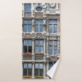 Close up of windows of famous guildhalls in Grote  Bath Towel
