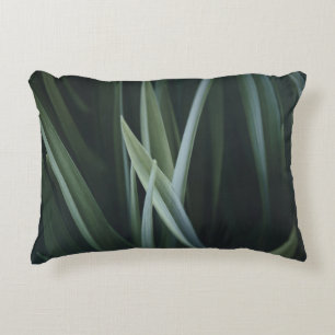 Close up photo of green linear leaves accent pillow
