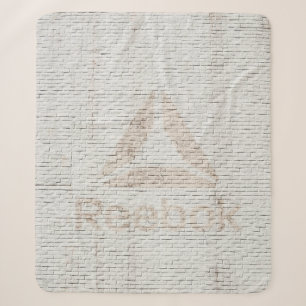 Close-up photo of Reebok logo on wall Sherpa Blanket