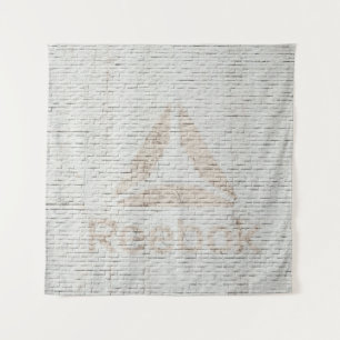Close-up photo of Reebok logo on wall Tapestry