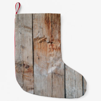 Close up photo of wooden panel small christmas stocking