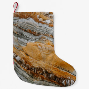 Close-up photography of gray and orange stones small christmas stocking