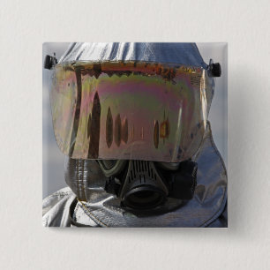 Close-up view of a firefighter 2 inch square button
