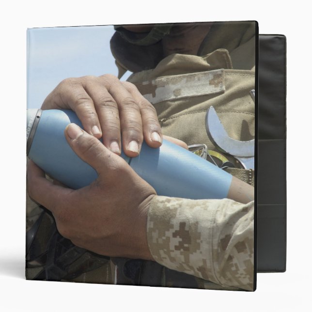 Close-up view of a soldier cradling a munition binder (Front/Inside)