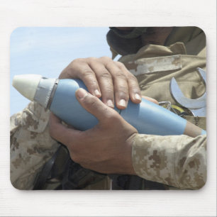 Close-up view of a soldier cradling a munition mouse pad