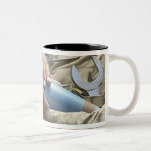 Close-up view of a soldier cradling a munition Two-Tone coffee mug