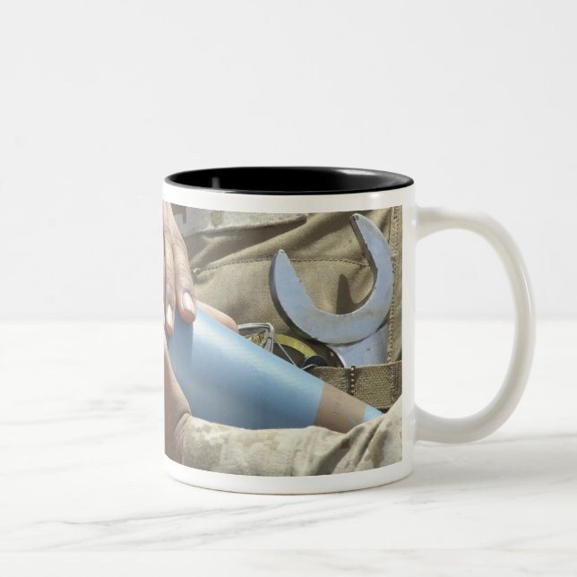 Close-up view of a soldier cradling a munition Two-Tone coffee mug (Right)