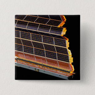 Close-up view of the solar arrays 2 inch square button