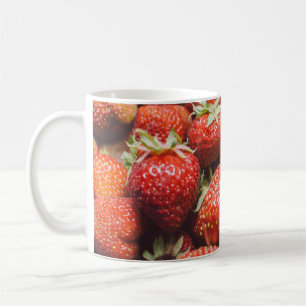 Close-up view on fresh summer strawberry with vint coffee mug