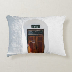 CLOSED 1852 WOODEN DOOR AT DAYTIME ACCENT PILLOW
