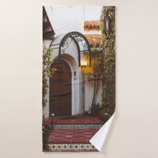 CLOSED BROWN WOODEN DOOR DURING DAYTIME BATH TOWEL