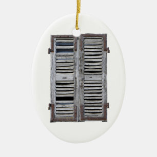 Closed window with old wood shutters ceramic ornament