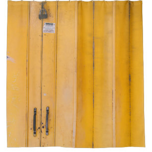 CLOSED YELLOW WOODEN DOOR WITH PADLOCK