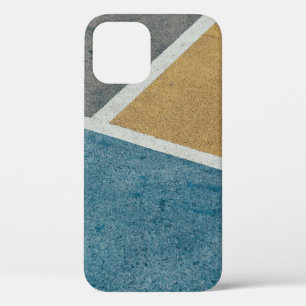 Closeup grey, yellow, and blue painted pavement iPhone 12 case